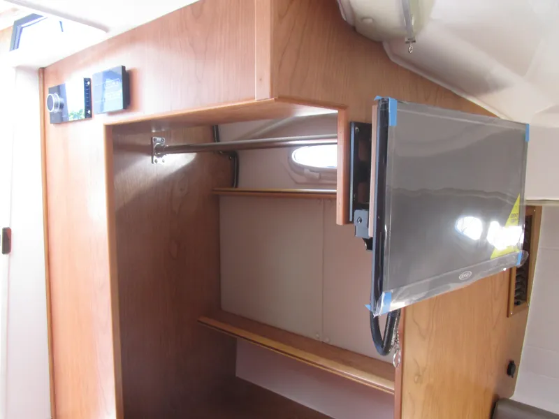 Slide: The Image of Interior of 2025 Cutwater C-288 Coupe featuring seating and a foldable table. - 26