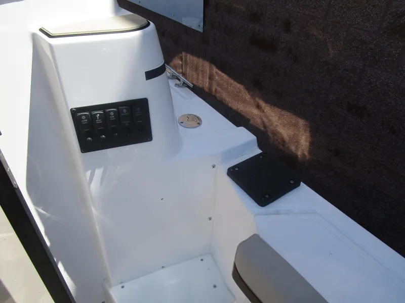 Slide: The Image of 2025 Cutwater C-288 Coupe interior with wooden table and cushioned seating. - 30