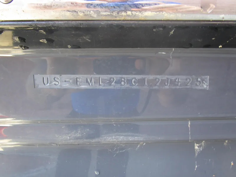 Slide: The Image of 2025 Cutwater C-288 Coupe interior cabin with cozy seating and striped cushions. - 32