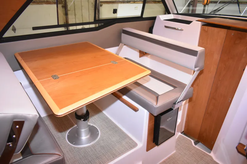 Slide: The Image of 2025 Cutwater C-288 Coupe bathroom with modern sink, toilet, and wooden cabinetry. - 37