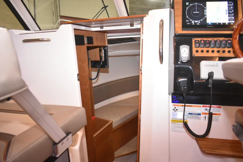 Slide: The Image of 2025 Cutwater C-288 Coupe bathroom with modern sink, wooden cabinetry, and compact design. - 38