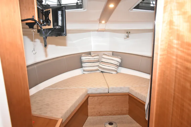 Slide: The Image of Interior view of 2025 Cutwater C-288 Coupe, featuring sleek wood finish and modern fixtures. - 39