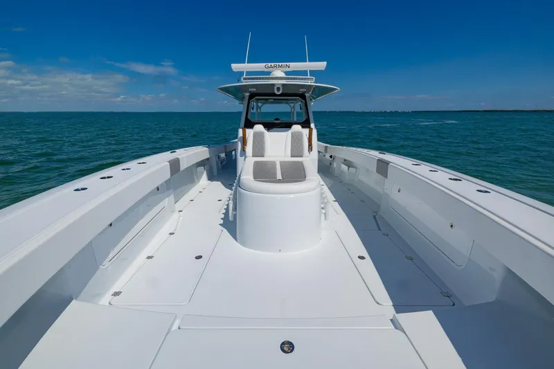 Slide: The Image of 2024 Freeman 47 boat on open water, showcasing spacious deck and sleek design. - 14