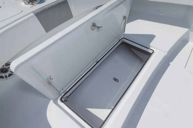 Slide: The Image of Open storage compartment on 2024 Freeman 47 boat deck. - 17