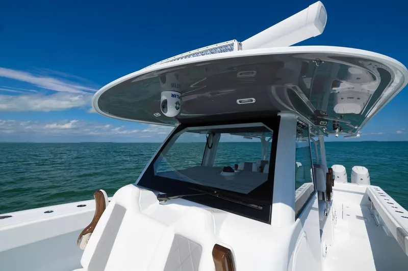Slide: The Image of 2024 Freeman 47 boat on open water, showcasing sleek design and modern features. - 20