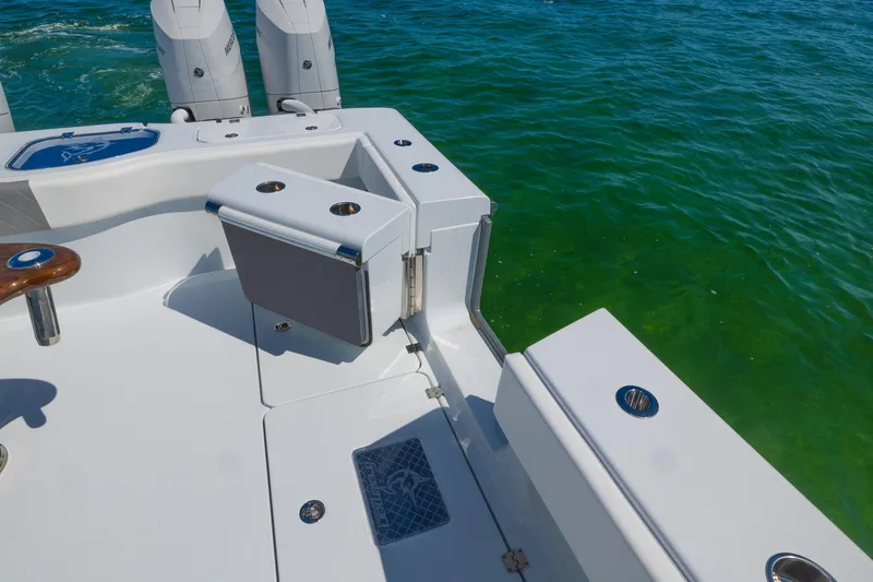 Slide: The Image of 2024 Freeman 47 boat deck with seating, overlooking clear green water. - 43