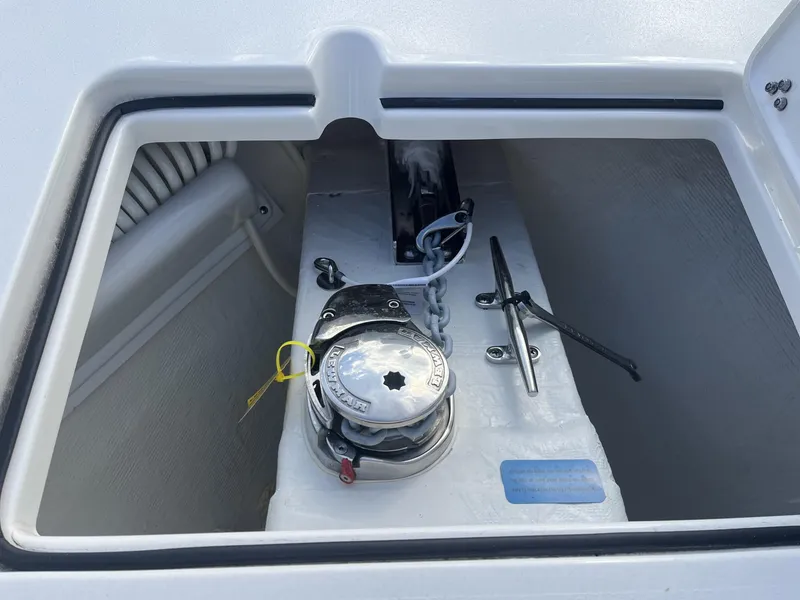Slide: The Image of Anchor locker of 2025 Cobia 240 CC boat with windlass and cleat. - 18