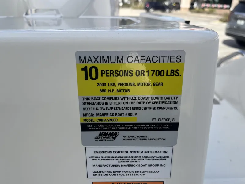 Slide: The Image of Capacity label on 2025 Cobia 240 CC boat, max 10 persons or 1700 lbs. - 27