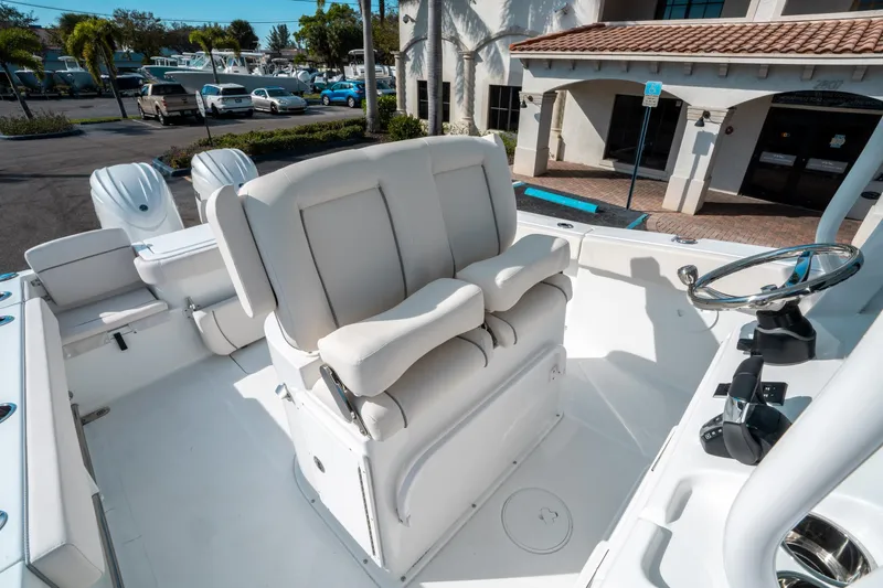 Slide: The Image of 2025 Sea Hunt GAMEFISH 27 CB boat interior with helm seat and steering wheel. - 28