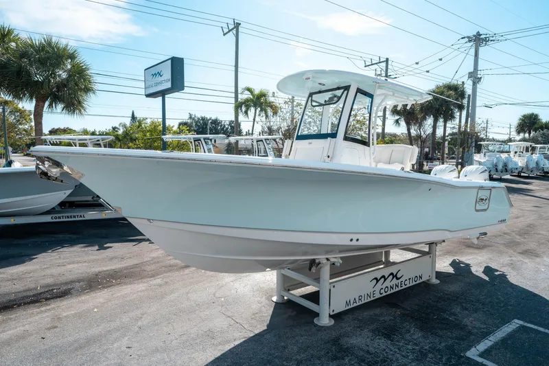 Slide: The Image of 2025 Sea Hunt GAMEFISH 27 CB boat displayed at Marine Connection dealership. - 6