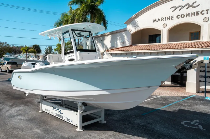 Slide: The Image of 2025 Sea Hunt GAMEFISH 27 CB boat displayed at Marine Connection dealership. - 8