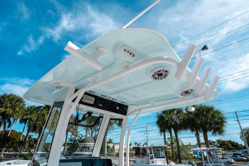 Slide: The Image of 2025 Sea Hunt GAMEFISH 27 CB boat top view with rod holders and speakers. - 23