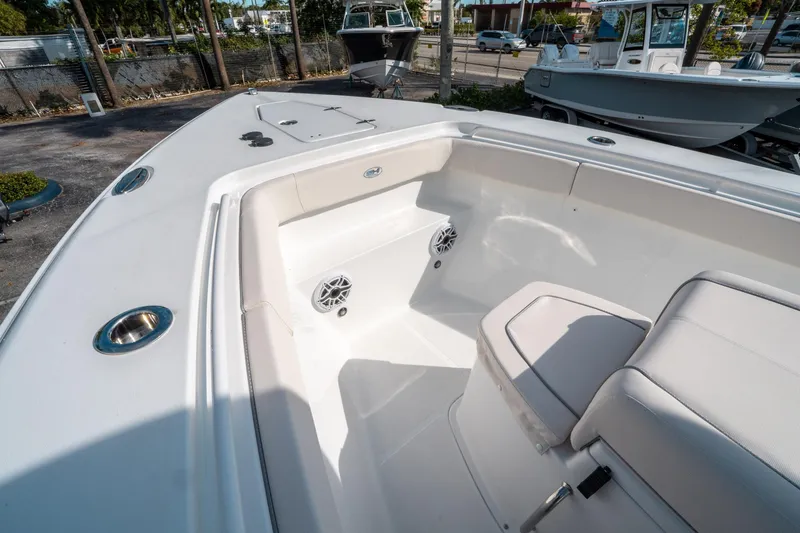 Slide: The Image of 2025 Sea Hunt GAMEFISH 27 CB boat interior with seating and speakers. - 36
