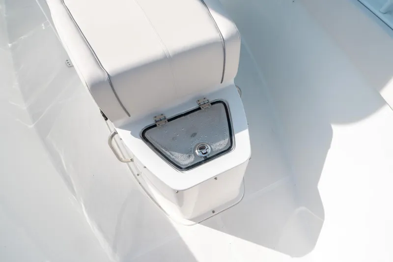 Slide: The Image of 2025 Sea Hunt GAMEFISH 27 CB boat seat with storage compartment. - 38