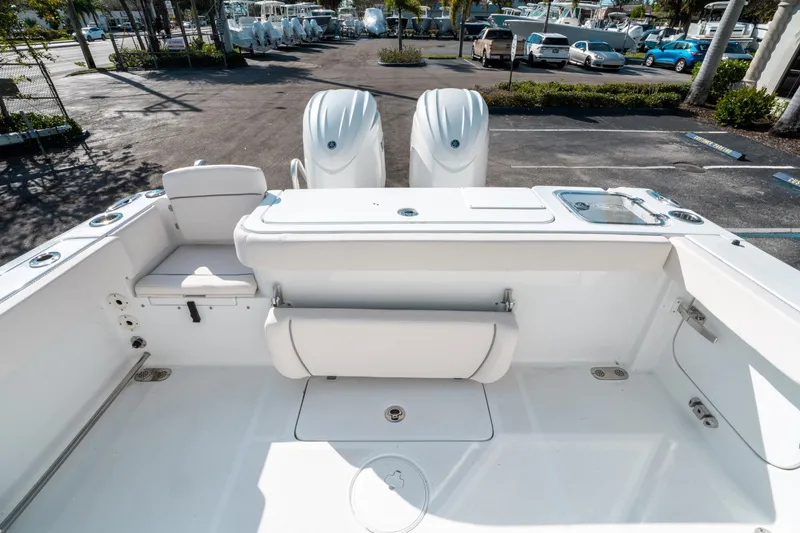 Slide: The Image of 2025 Sea Hunt GAMEFISH 27 CB boat interior with dual engines, spacious seating, and fishing amenities. - 10
