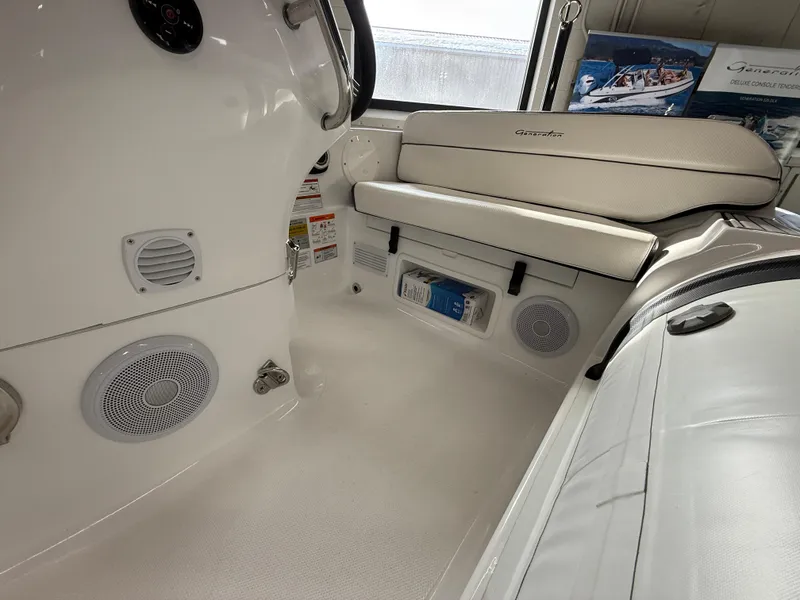 Slide: The Image of 2025 Walker Bay Generation 450 DLX interior with seating and audio system. - 13