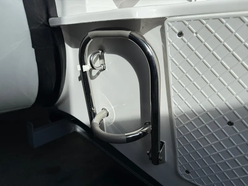 Slide: The Image of Walker Bay Generation 450 DLX 2025 boat detail, featuring stainless steel handle and textured panel. - 15