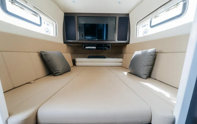 Slide: The Image of 2021 Scout 380 LXF cabin interior with beige seating and TV. - 14