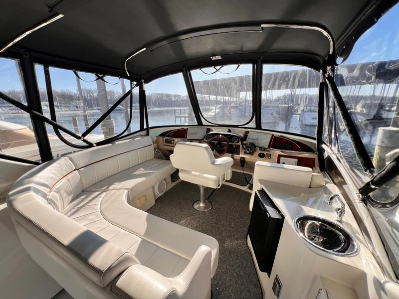 Slide: The Image of Interior of 2005 Carver 444 Cockpit Motor Yacht with seating and helm. - 15