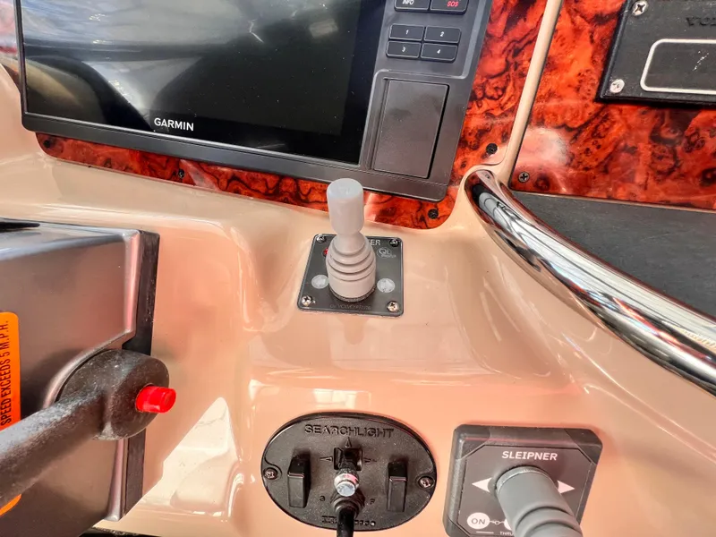 Slide: The Image of Control panel of 2005 Carver 444 Cockpit Motor Yacht with Garmin display and joystick. - 17