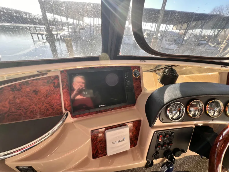Slide: The Image of Helm of 2005 Carver 444 Cockpit Motor Yacht with Garmin navigation system. - 24