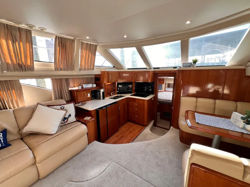 Slide: The Image of Luxurious interior of 2005 Carver 444 Cockpit Motor Yacht with elegant furnishings and modern amenities. - 33