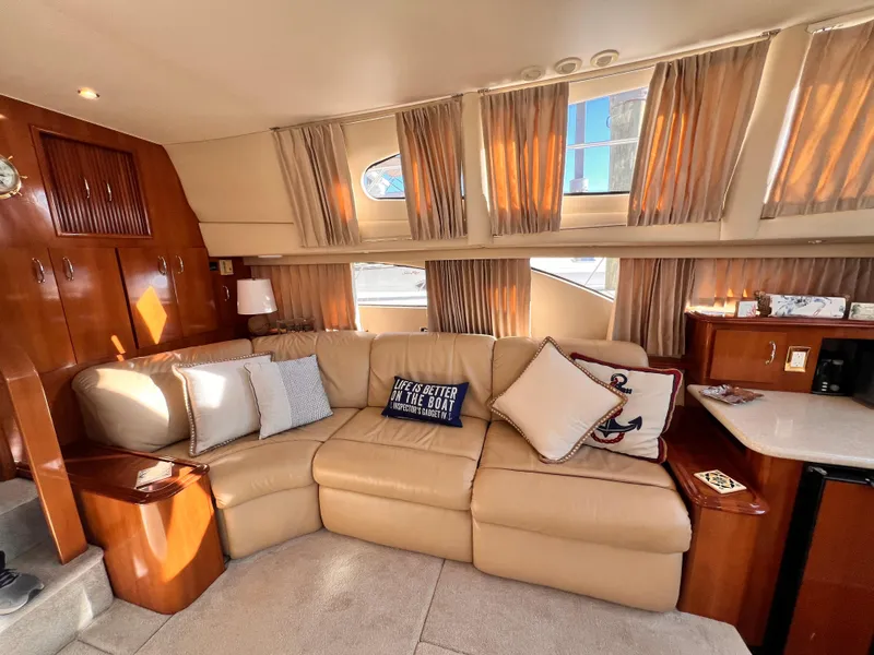 Slide: The Image of Luxurious interior of 2005 Carver 444 Cockpit Motor Yacht with beige leather seating. - 34