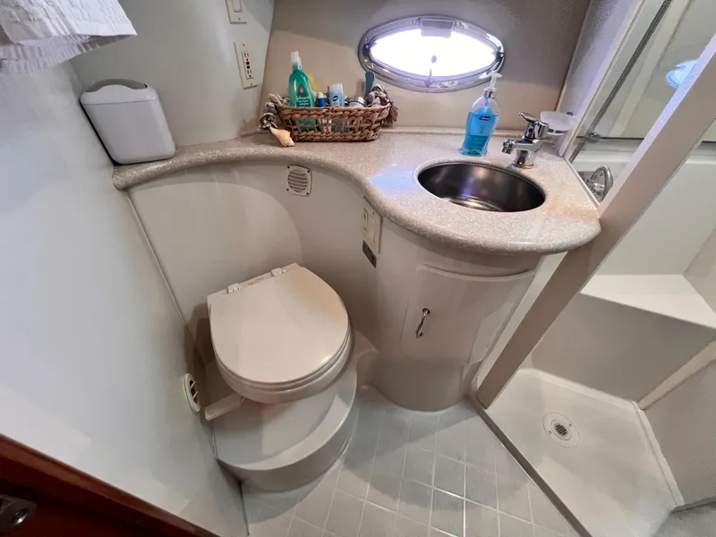 Slide: The Image of Bathroom interior of 2005 Carver 444 Cockpit Motor Yacht with sink and toilet. - 40
