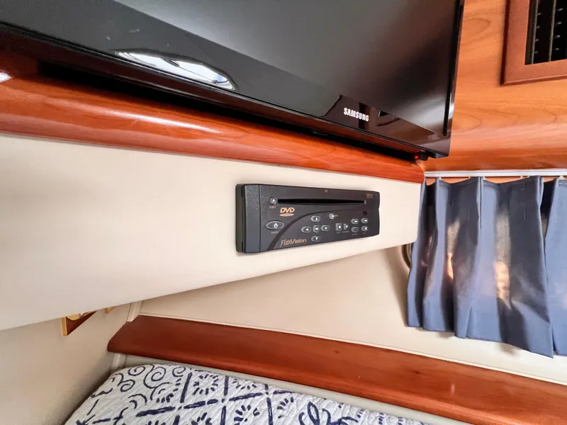Slide: The Image of Interior of 2005 Carver 444 Yacht with TV and DVD player setup. - 43
