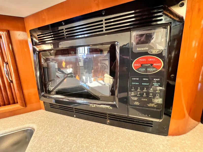 Slide: The Image of Microwave oven in 2005 Carver 444 Cockpit Motor Yacht kitchen area. - 45