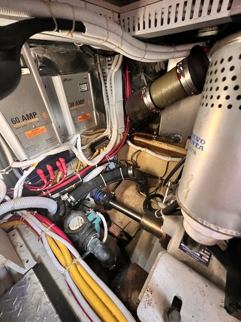 Slide: The Image of Engine room of 2005 Carver 444 Cockpit Motor Yacht with wiring and equipment. - 50