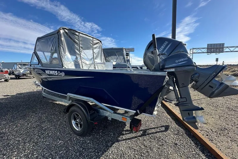 Slide: The Image of 2025 Hewescraft 200 Sportsman boat with Yamaha outboard motor on a trailer. - 3