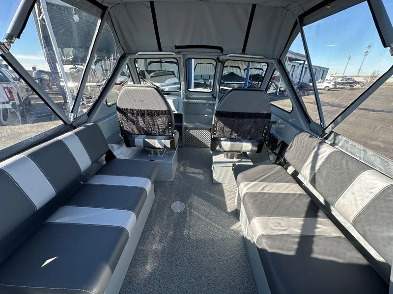 Slide: The Image of Interior of 2025 Hewescraft 200 Sportsman boat with spacious seating and modern design. - 5