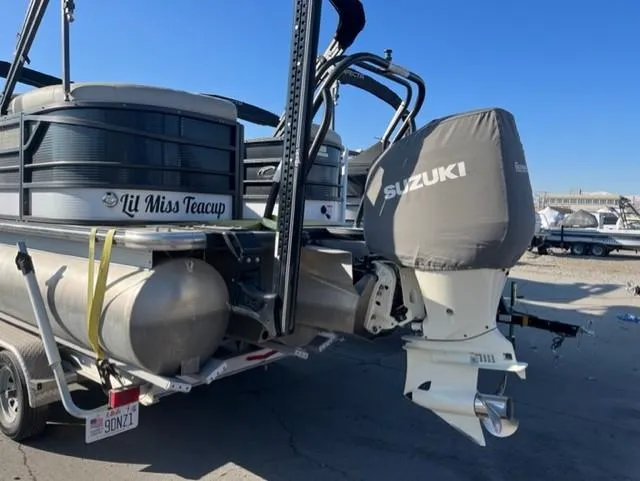 Slide: The Image of 2019 Crest 230 SLC pontoon boat with Suzuki outboard motor, labeled "Lil Miss Teacup." - 2