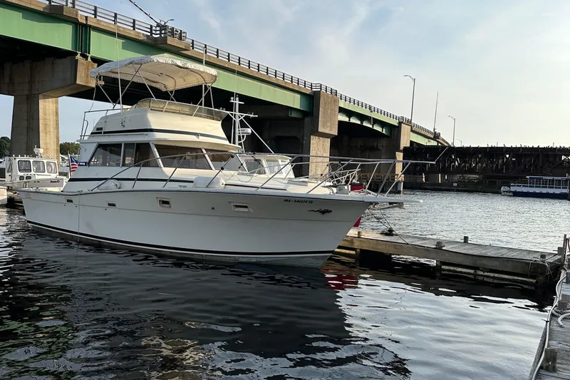 The Image of 1978 Viking Boats 35 docked near a bridge on a sunny day. - 0