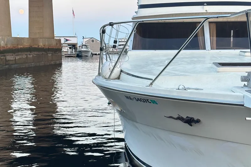 Slide: The Image of 1978 Viking Boats 35 docked in a marina, showcasing its classic design and sturdy build. - 2