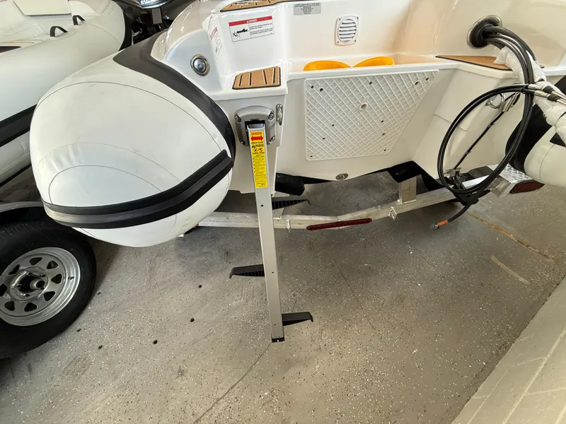 Slide: The Image of Walker Bay Generation 14 LTE 2025 boat on trailer, featuring inflatable pontoons. - 10