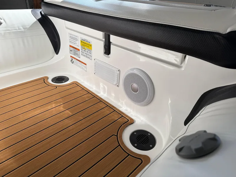 Slide: The Image of Walker Bay Generation 14 LTE 2025 boat interior with teak flooring and speaker system. - 11