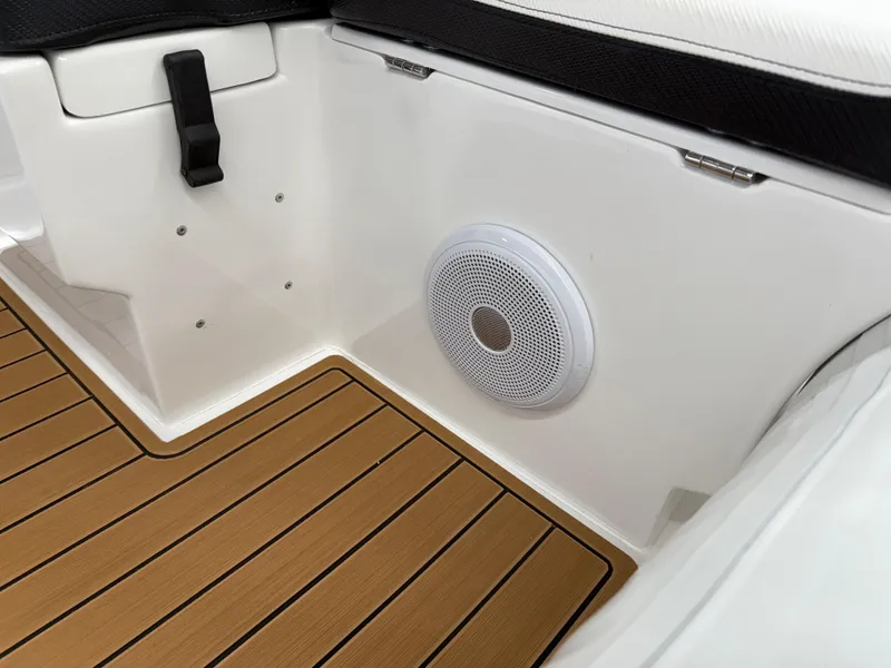 Slide: The Image of 2025 Walker Bay Generation 14 LTE boat interior with speaker and teak flooring. - 12