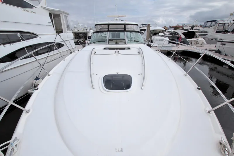 Slide: The Image of 2009 Sea Ray 44 Sundancer yacht docked among other boats. - 20