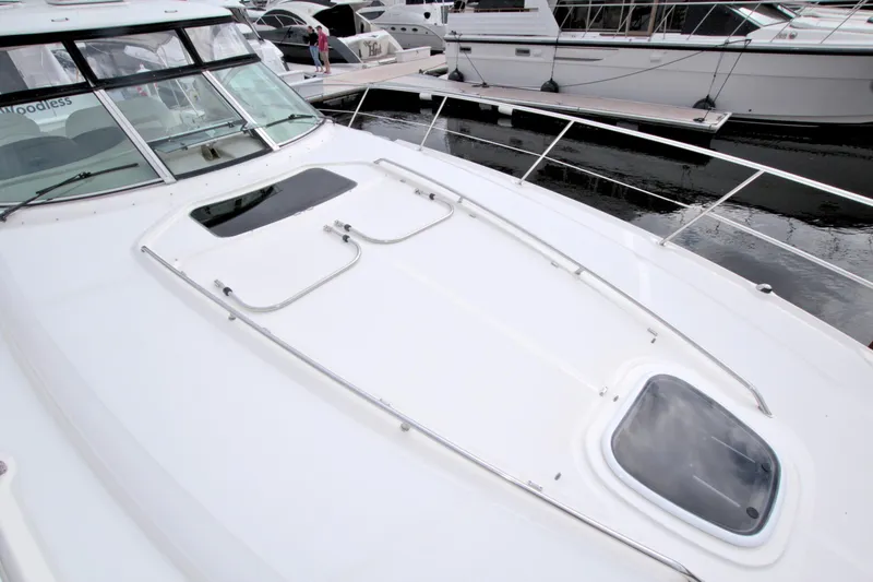 Slide: The Image of 2009 Sea Ray 44 Sundancer yacht deck, featuring sleek design and spacious layout. - 21