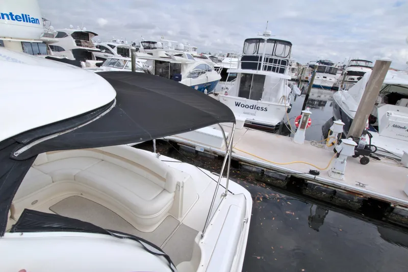 Slide: The Image of 2009 Sea Ray 44 Sundancer docked among other boats in a marina. - 25