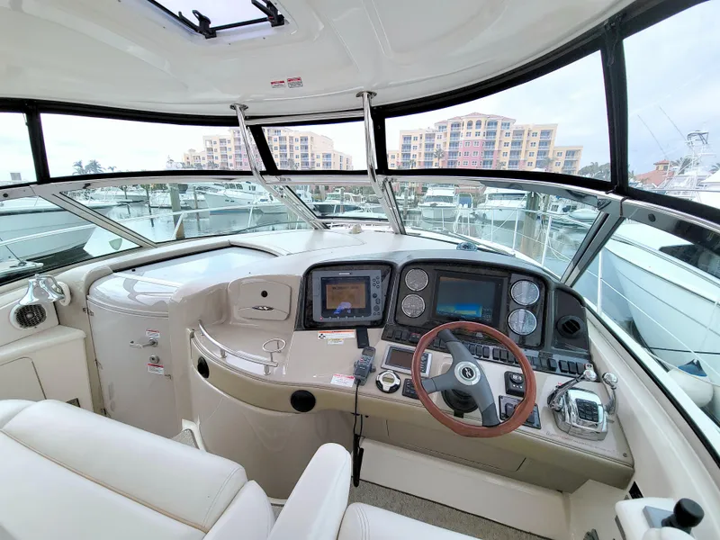 Slide: The Image of Helm of 2009 Sea Ray 44 Sundancer yacht with modern navigation equipment. - 28