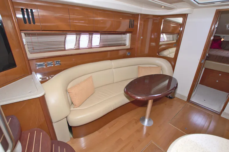 Slide: The Image of Luxurious interior of 2009 Sea Ray 44 Sundancer yacht with elegant seating and table. - 34