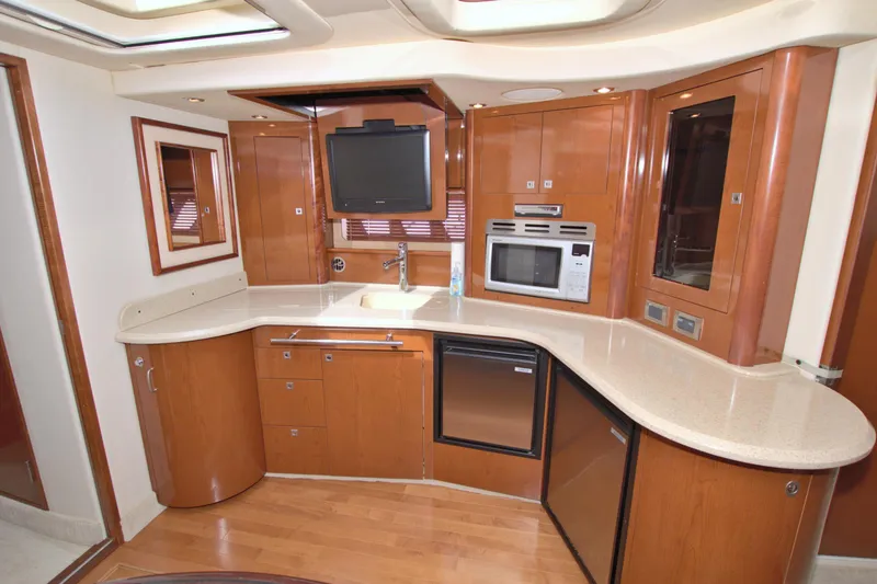 Slide: The Image of Luxurious kitchen interior of 2009 Sea Ray 44 Sundancer yacht with modern appliances. - 36