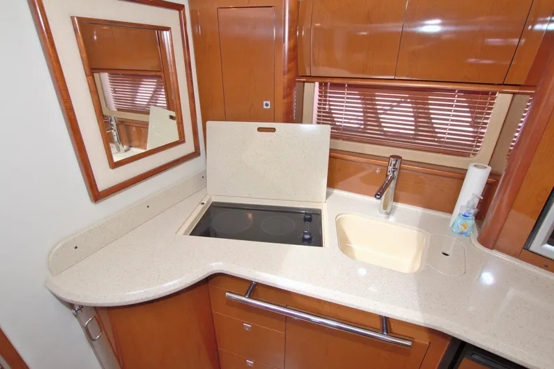 Slide: The Image of 2009 Sea Ray 44 Sundancer yacht kitchen with sleek countertops and modern fixtures. - 37