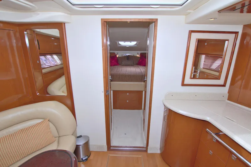 Slide: The Image of Interior of 2009 Sea Ray 44 Sundancer yacht with modern furnishings and cozy cabin. - 38