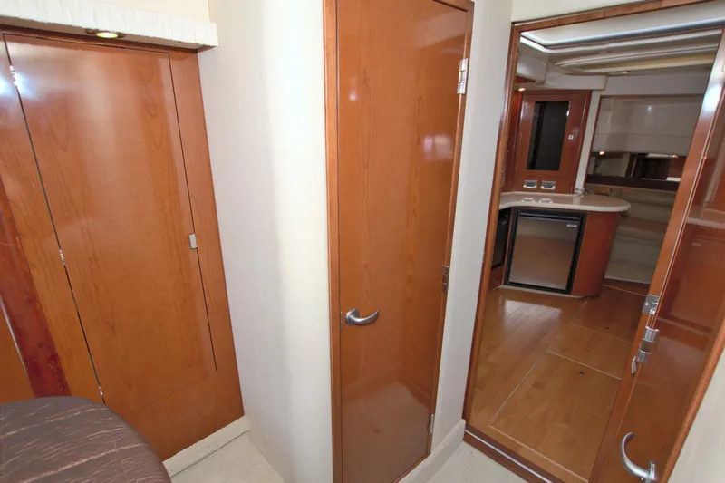 Slide: The Image of Interior view of 2009 Sea Ray 44 Sundancer yacht with wooden cabinetry and modern design. - 46