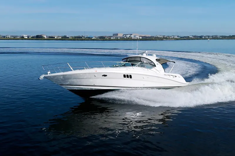 Slide: The Image of 2009 Sea Ray 44 Sundancer cruising on calm waters. - 7