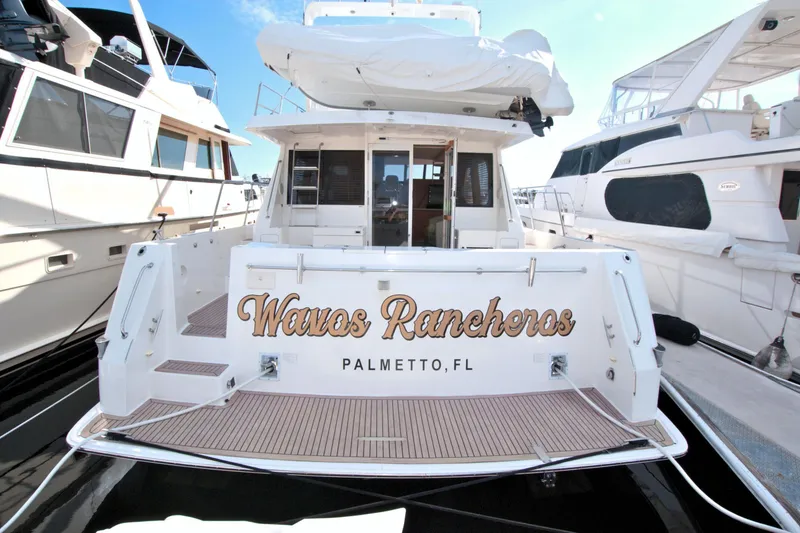Slide: The Image of West Bay 58 Sonship yacht, 1999 model, docked in Palmetto, FL, named "Wavos Rancheros". - 13